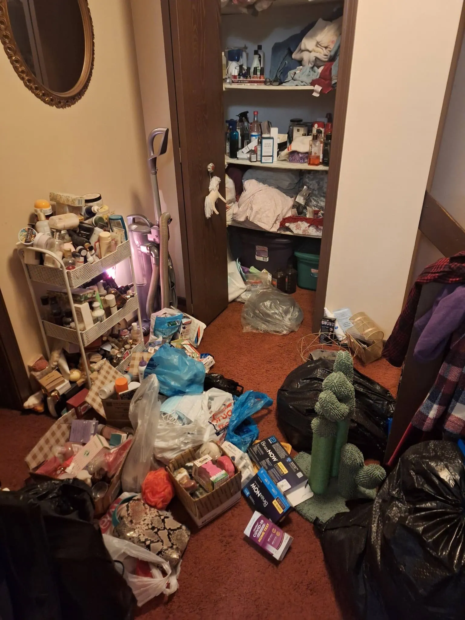 messy linen closet being cleaned out