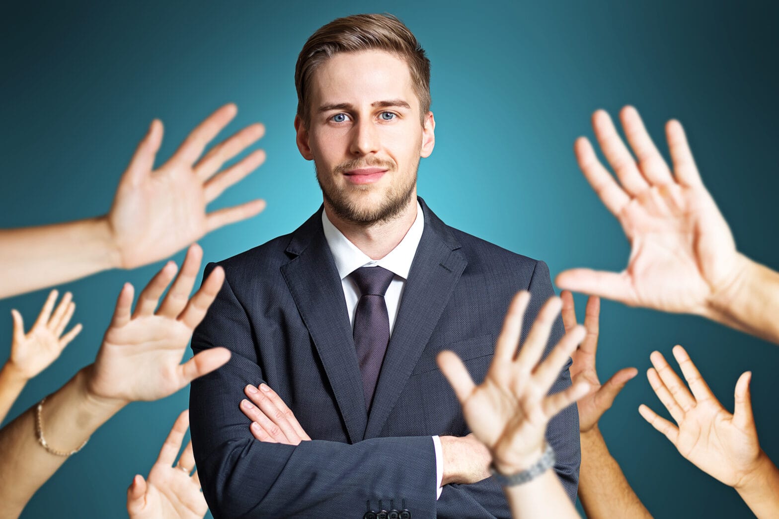 likable man with many hands reaching out to him
