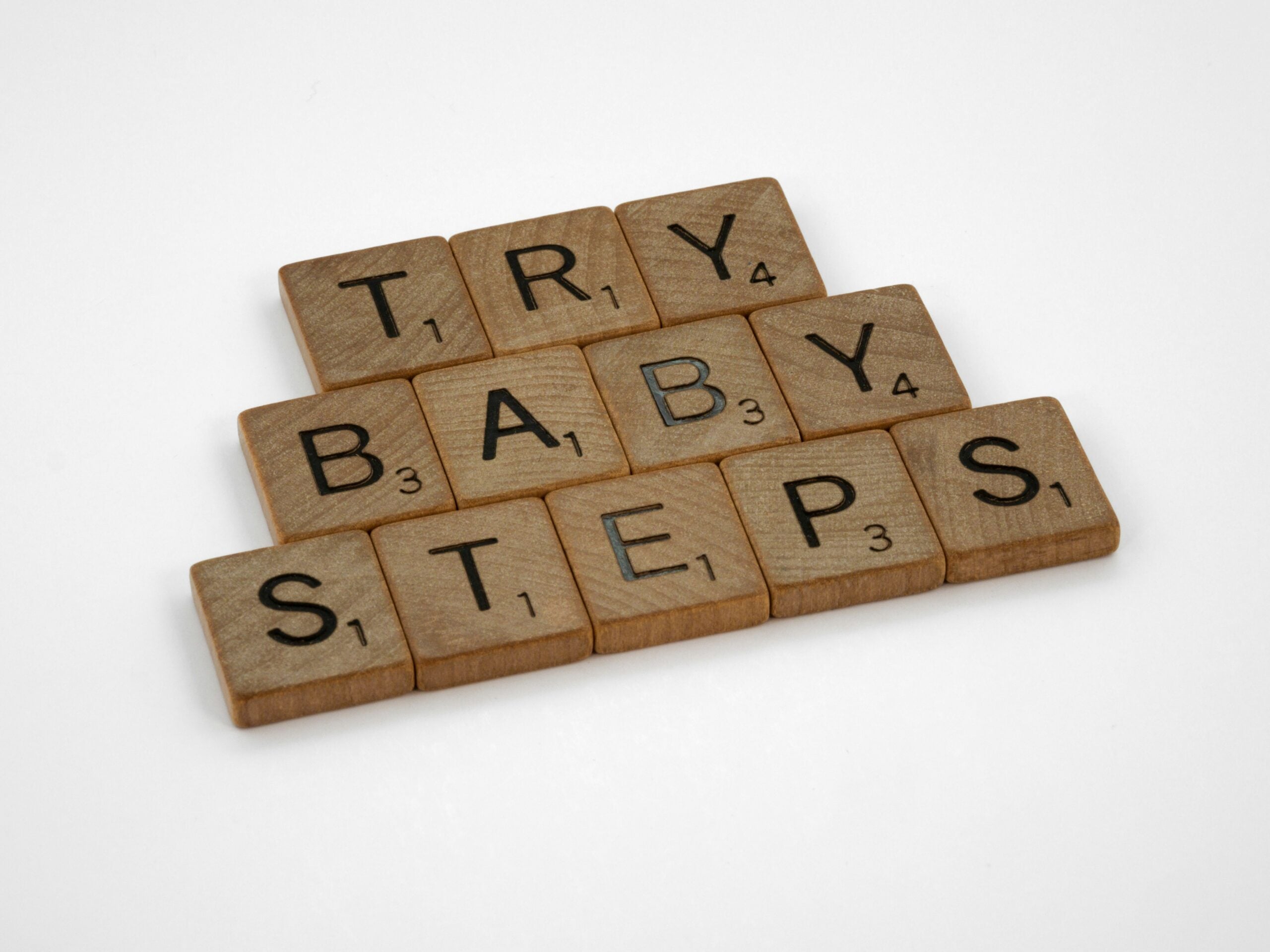 Scrabble tiles spelling out Try Baby Steps