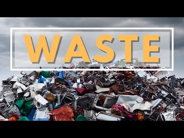 landfill with garbage and the word "waste"